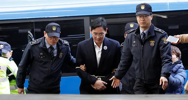After night in cell, Samsung scion taken for questioning