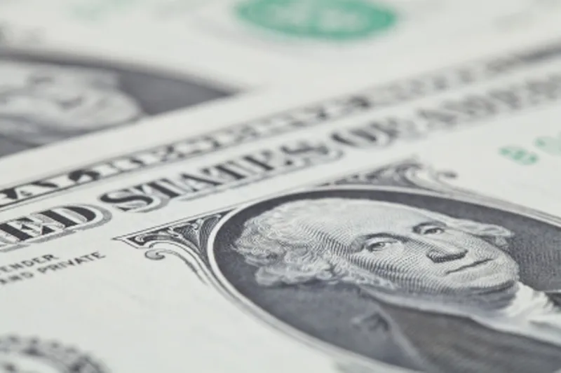 Dollar eases off 14-year peak as market braces for Trump reality check