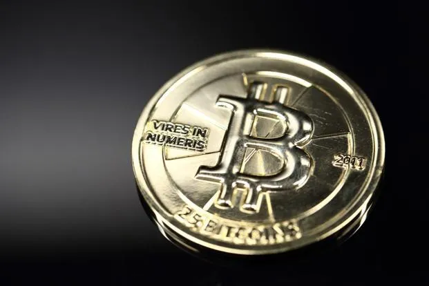 Bitcoin jumps above $1,000 for first time in three years
