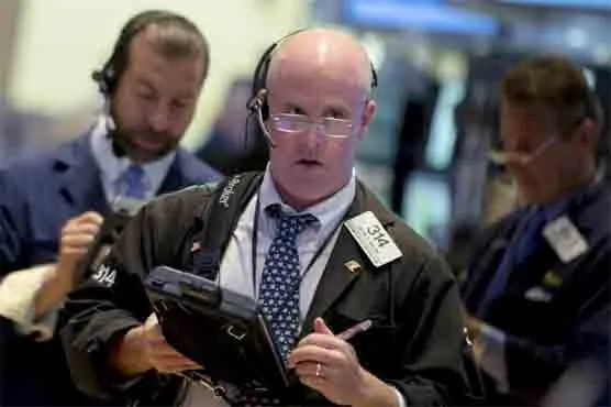 U.S. Stocks Pare Yearly Gain as Dollar, Oil Slip: Markets Wrap
